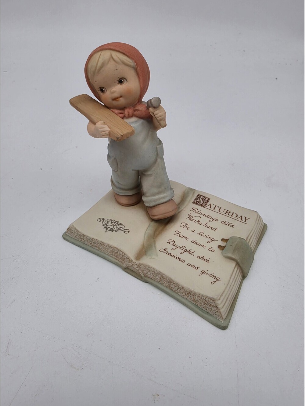 Enesco Saturday's Child Works Hard For A Living Porcelain Figurine